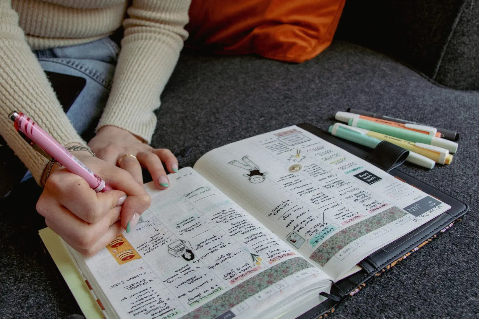 Someone writing in her journal